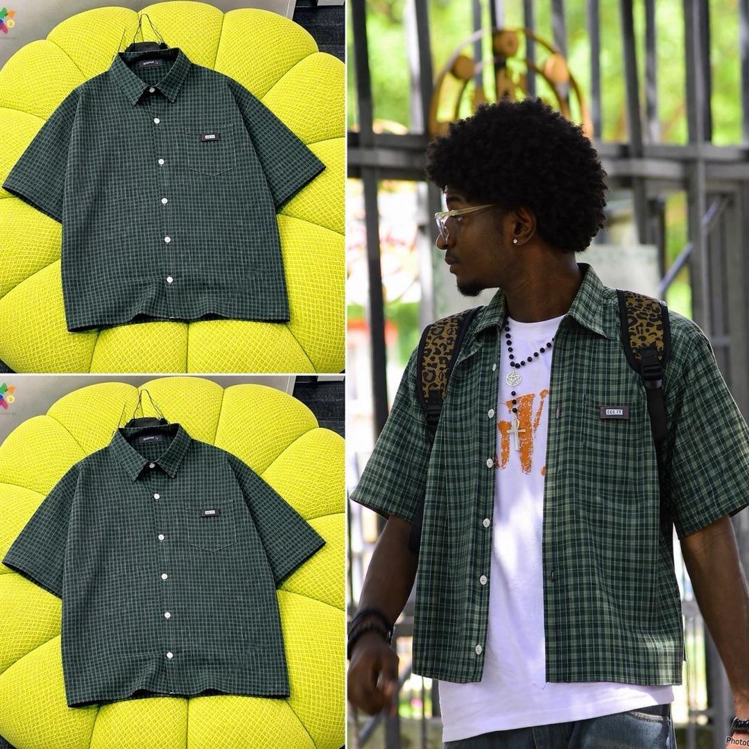 A dark green plaid short sleeve button down shirt on a yellow couch and a man wearing the shirt outdoors.