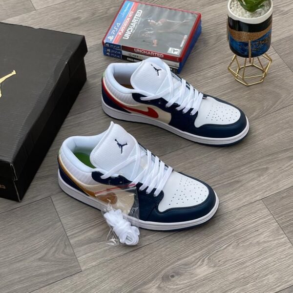 A pair of white, navy, and gold Air Jordan 1 Mid sneakers on a wooden floor, exuding Modern Luxury and Urban Edge style.