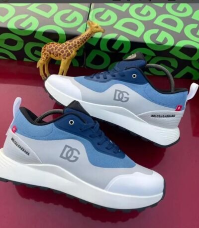 A pair of Dolce & Gabbana sneakers in blue and white, showcasing Modern Luxury and Urban Edge design, with a focus on Timeless Quality.