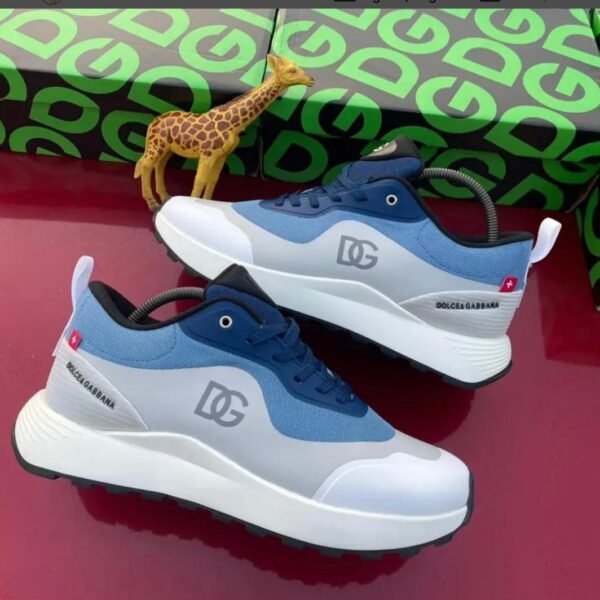 A pair of Dolce & Gabbana sneakers in blue and white, showcasing Modern Luxury and Urban Edge design, with a focus on Timeless Quality.