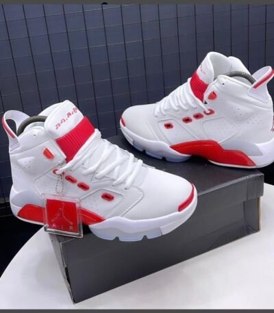 A pair of white and red Air Jordan high-top sneakers displayed on a shoe box, showcasing their sleek design and modern luxury appeal.