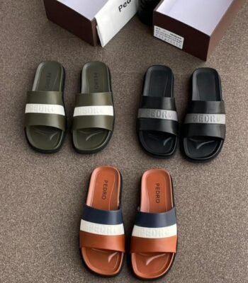 A display of stylish Pedro slides in various colors, showcasing Modern Luxury and Urban Edge design.