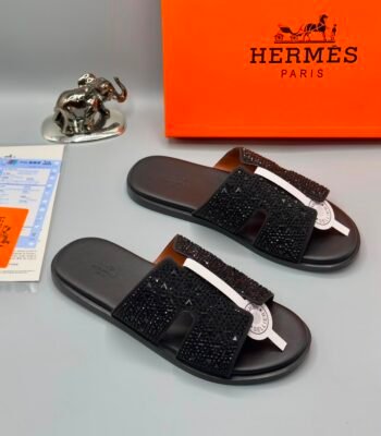 Exquisite black beaded slides with white accents, presented with Hermes Paris box and luxury accessories.