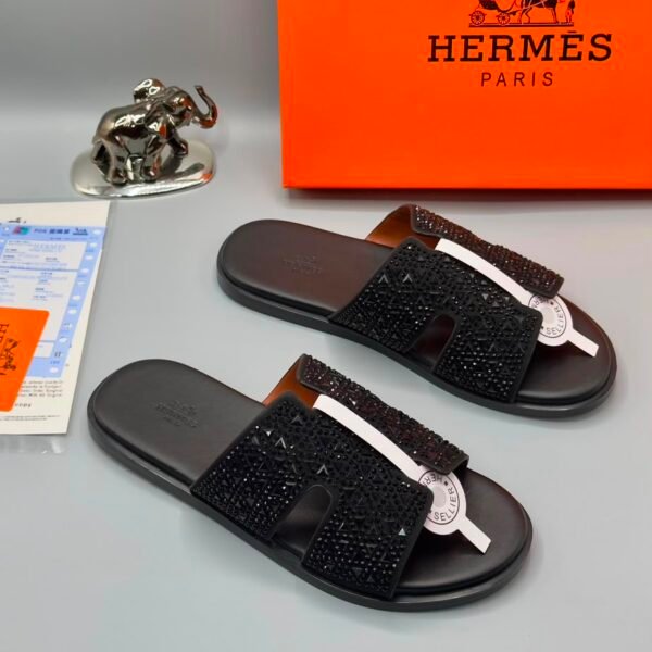 Exquisite black beaded slides with white accents, presented with Hermes Paris box and luxury accessories.