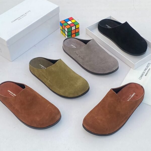 A stylish display of suede half shoes in various colors, exuding Modern Luxury and Urban Edge, with a focus on Timeless Quality.