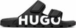 A pair of black HUGO slides on a red shoe box, exuding Modern Luxury and Urban Edge.