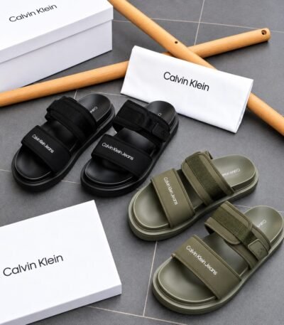 Calvin Klein slides in black and green, showcasing Modern Luxury and Urban Edge style, with Timeless Quality.