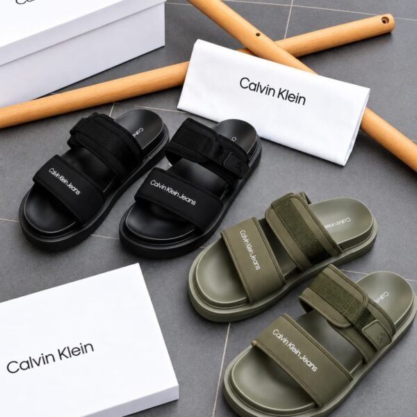Calvin Klein slides in black and green, showcasing Modern Luxury and Urban Edge style, with Timeless Quality.
